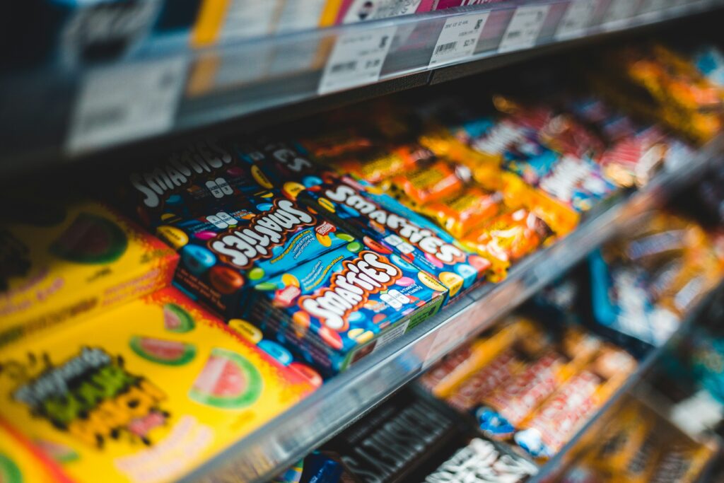 Candy aisle at a store. Photo by Erik Mclean on Unsplash